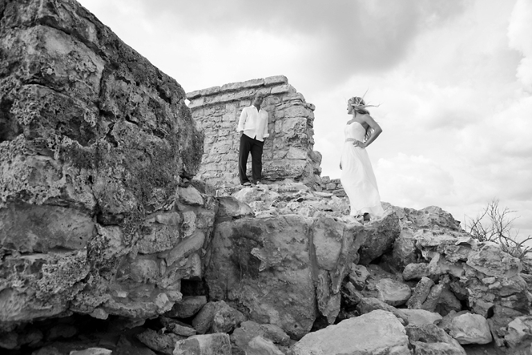 Bride and groom on Mayan ruins in black and white