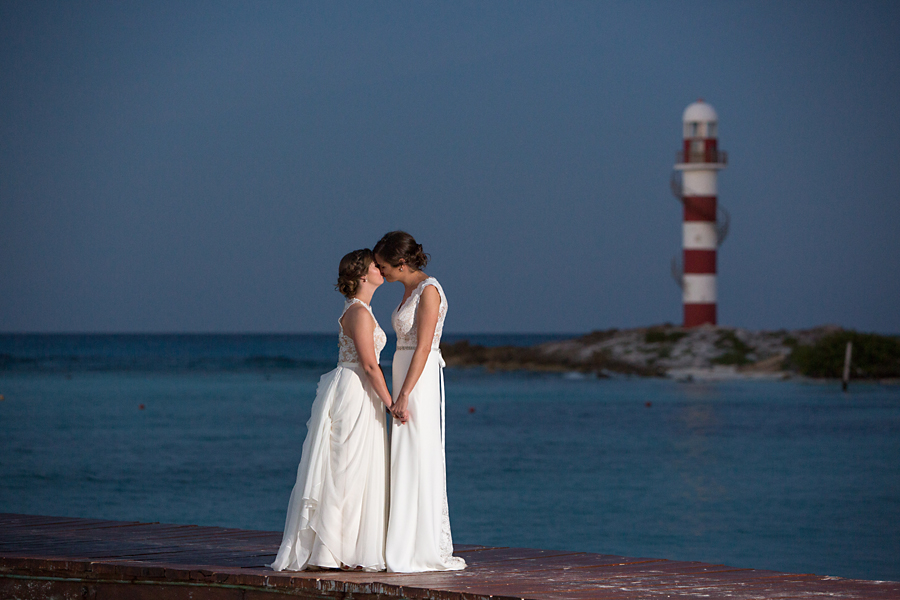 Two brides at lighthouse in Cancun