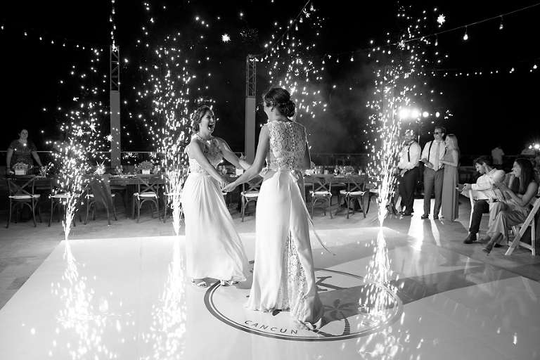 Two brides first dance with fireworks
