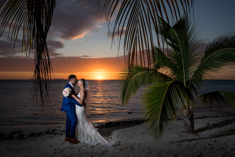 Bride and groom at sunset on beach